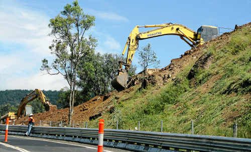 Excavators working about a kilometre east of the helipad yesterday, where heavy rain caused a landslip below the road surface and a new embankment has been built. Excavators working about a kilometre east of the helipad yesterday, where heavy rain caused a landslip below the road surface and a new embankment has been built.